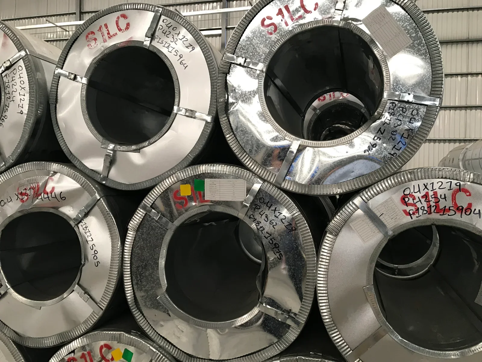 Large galvanized steel coils prepared for handling